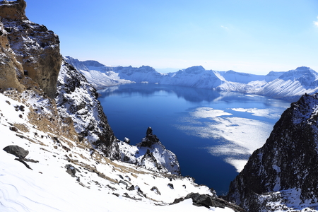 crater lake with snow in winterの写真素材