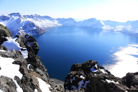 crater lake with snow in winterの写真素材
