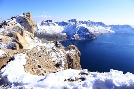 crater lake with snow in winterの写真素材