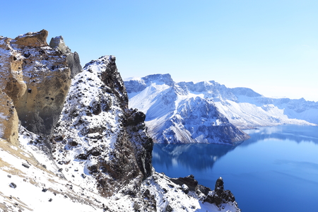 crater lake with snow in winterの写真素材