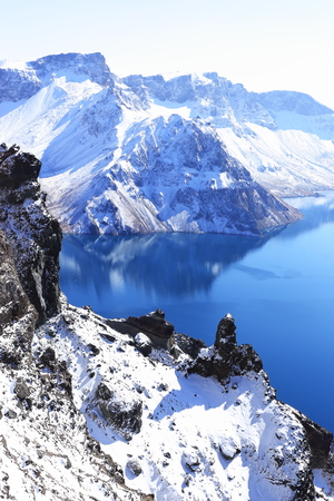 crater lake with snow in winterの写真素材