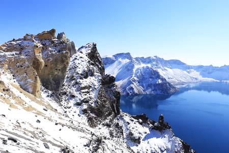 crater lake with snow in winterの写真素材