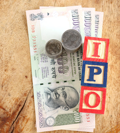 Initial public offering, or IPO, concept, indicated with wooden blocks with letters forming the word...
