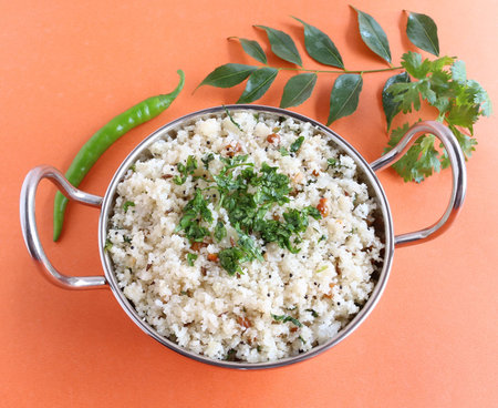 Rice rava upma, a south Indian vegetarian food, is made from coarsely ground raw rice.