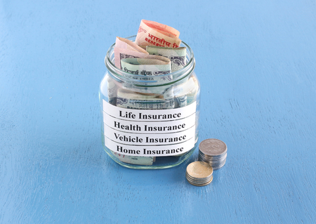 Payment of the life, health, vehicle and home insurance premium in Indian rupees concept.の写真素材