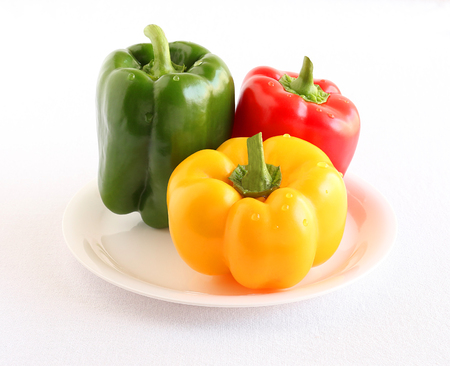 Green, yellow and red peppers, organic type and fresh, which are said to offer many health benefits.の写真素材