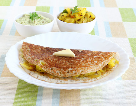 Masala dosa, a south Indian vegetarian, traditional and popular crepe, with a filling of a mixture...