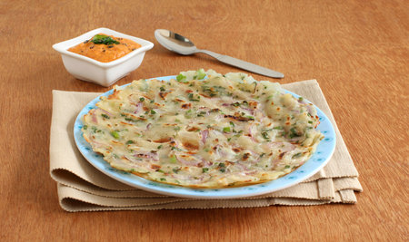 Masala rice roti, an Indian vegetarian bread with onion as a main ingredient, which is typically...