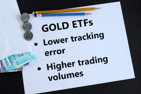 Gold exchange traded funds, or ETFs, an investment in Indian rupees concept, highlighting two of the...