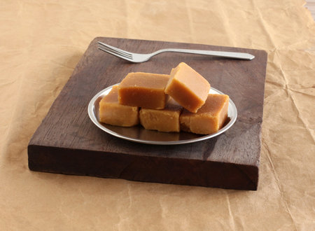 Mysore pak, a traditional, popular, and delicious sweet dish native to the city of Mysore, Karnataka, India, is made from ingredients like gram flour, ghee and sugar.の写真素材