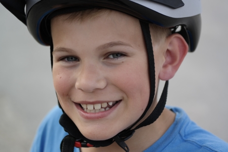 Smiling boy with bicycle helmetの素材