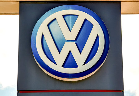 Volkswagen logo on a facade. Volkswagen is a German car manufacturer headquartered in Wolfsburg,...