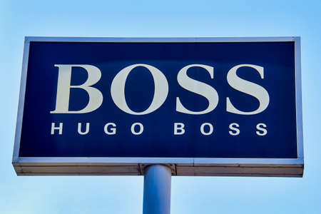 Hugo Boss sign on a store. Hugo Boss is a German luxury fashion house. It was founded in 1924 by Hugo Boss and is headquartered in Metzingen, Germanyのeditorial素材
