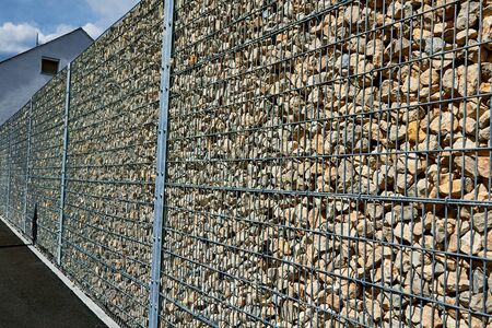 Stones in metal wire cage, Stone gabion wall.の写真素材