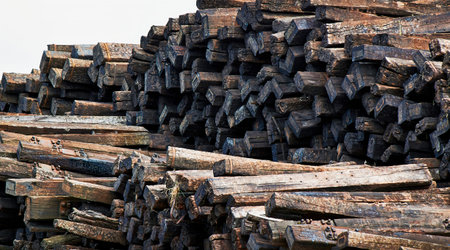 wooden planks left in recycling facilities for reuse, removed from railways.の写真素材
