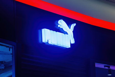 Puma logo on a facade. Puma is a major german multinational company that produces athletic, casual...