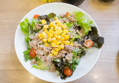 Tuna variety salad colorful on wooden tableの写真素材