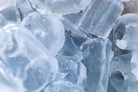 Ice cube texture color soft blue backgroundの写真素材