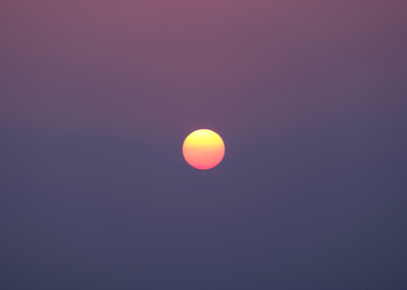 Sun sphere colorful sky at sunsetの写真素材
