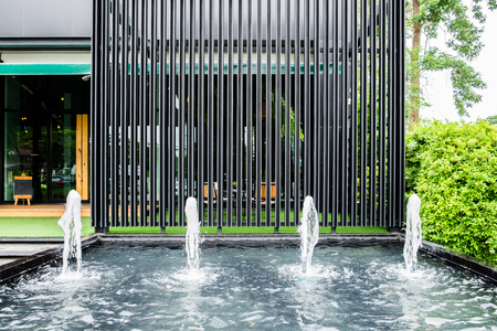 Front shop fountain with black steel panel decorate luxury modernの写真素材