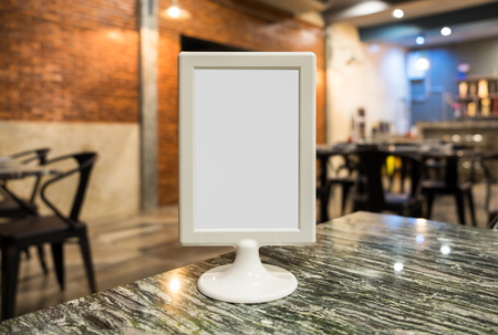 Label white blank on table top in restaurantの写真素材