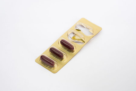 Ginseng capsules in foil blister pack,isolated on white background