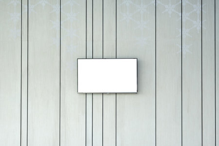 Flat blank screen tv on decorative gray wall