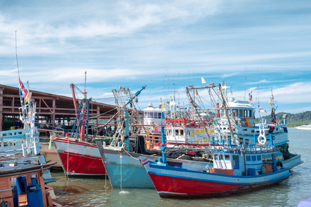 Wood fishing boats moored at harbourの写真素材