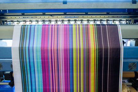 Large inkjet printer working multicolor cmyk on vinyl banner