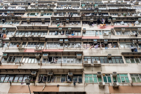Old surface apartment building with decay windowsの写真素材
