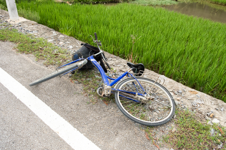 Old bicycle accident fall on concrete roadの写真素材