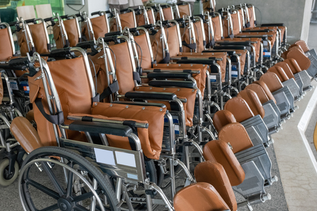 Rows empty wheelchairs parked prepare at hospitalの写真素材