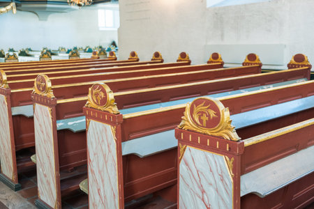 Rows of wooden christian church benchesの写真素材