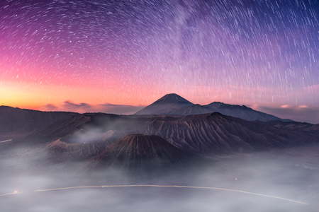 Mount active volcano, Batok, Bromo, Semeru with starry and fog at dawn. Bromo Tengger Semeru National Park, East Java, Indonesiaの写真素材