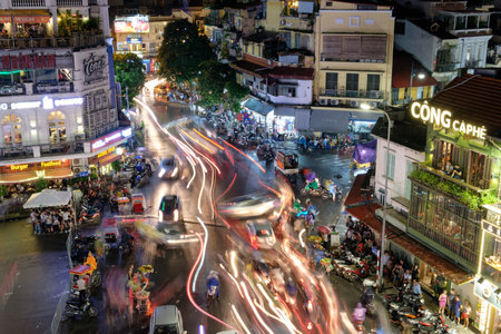 Hanoi, Vietnam : Sep 09 2017 : Pedestrians on road with traffic jam in old quarter town in rainy at nightのeditorial素材