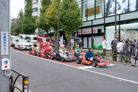 Tokyo, Japan - Nov 08 2017 : Tourists foreigner with cartoon costume driving go-kart in tokyo cityのeditorial素材