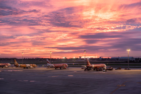 Bangkok, Thailand - Sep 06 2017 : Airplane parked in airport at beautiful sunset, Don Muang, Thailandのeditorial素材
