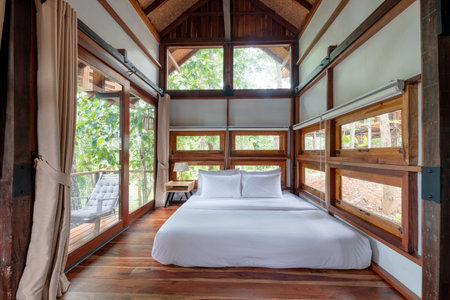 Nan, Thailand - Aug 04 2018 : Interior wooden bedroom with terrace in tropical forestのeditorial素材