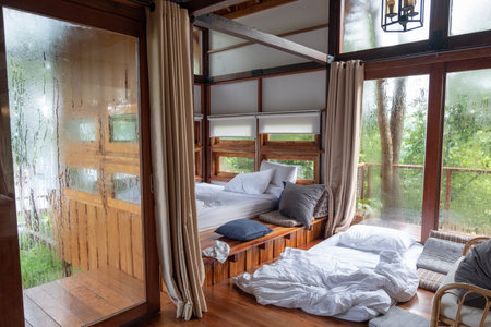 Nan, Thailand - Aug 05 2018 : Interior cozy bedroom after waking up in wooden house at morningのeditorial素材