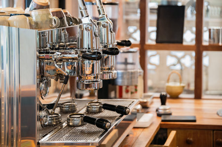 Aluminium large coffee maker two grinders in wooden bar in cafe