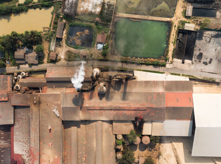 Industry factory manufacturing with emission smoke from chimneys into skyのeditorial素材