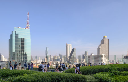 Bangkok, Thailand - Jan 26 2019 : People relaxing in garden on patio and views of skyscraper at bangkokのeditorial素材