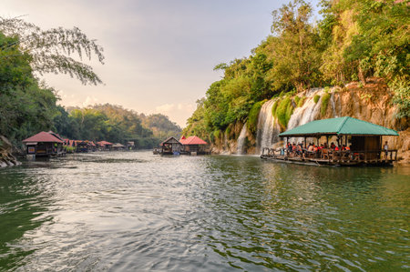 Kanchanaburi, Thailand - Jan 01 2019 : Tourists rafting to Sai yok yai waterfall in tropical rainforest at national parkのeditorial素材