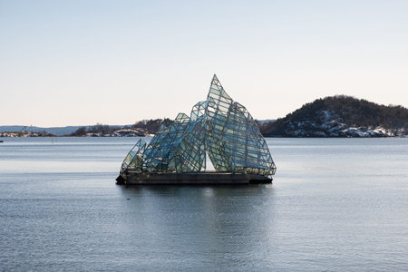 Oslo, Norway - Mar 27 2018 : She Lies, art public sculpture made of stainless steel and glass panels...