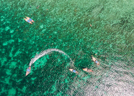 Above of Beautiful tropical sea with wooden long-tail boat sailing at lipe island