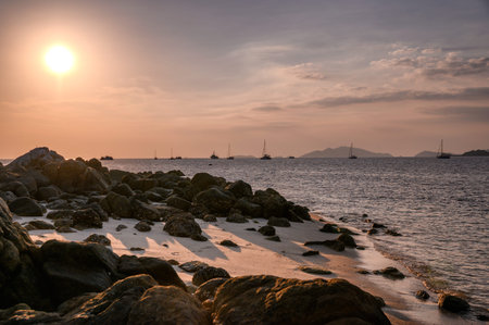 Tropical sea with rocks on coastline at sunset in lipe island