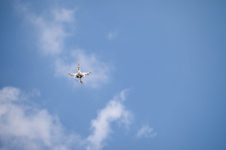 Unmanned uav aircraft or Drone for filming with flying in blue sky