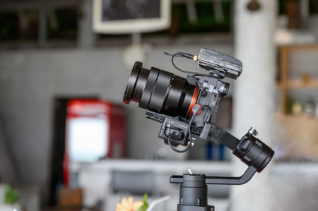 Mirrorless camera with mic wireless on gimbal stabilizer for filming