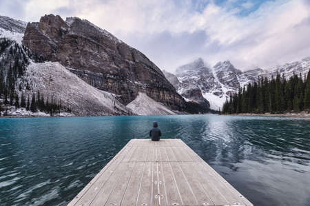 Scenic road trip with rocky mountain in autumn forest at Icefields Parkway, Canadaの写真素材