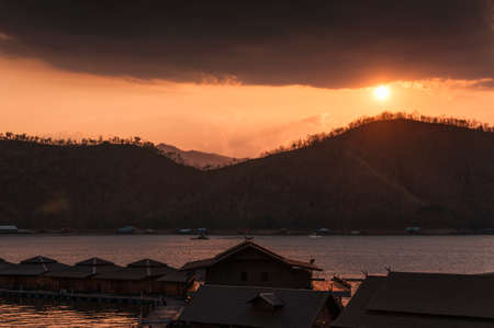 Set of tea jug with teacup and plant in vase on timber at teahouseの写真素材